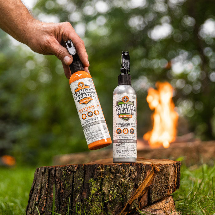 Ranger Ready Picaridin and Permethrin Repellent Spray In Front of a Camp Fire